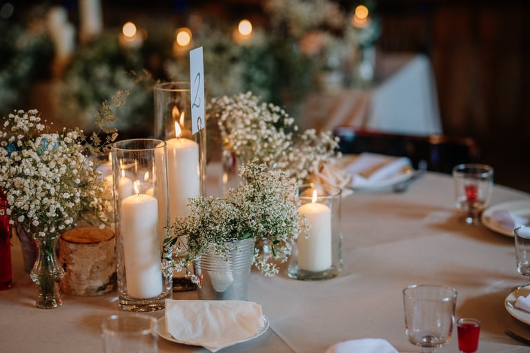 Wedding table centerpiece with candles and elegant settings