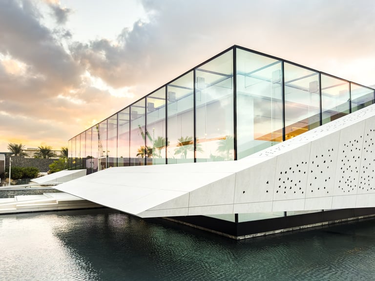 Bassam Freiha Art Foundation modern pavilion with grand arches and reflections on water